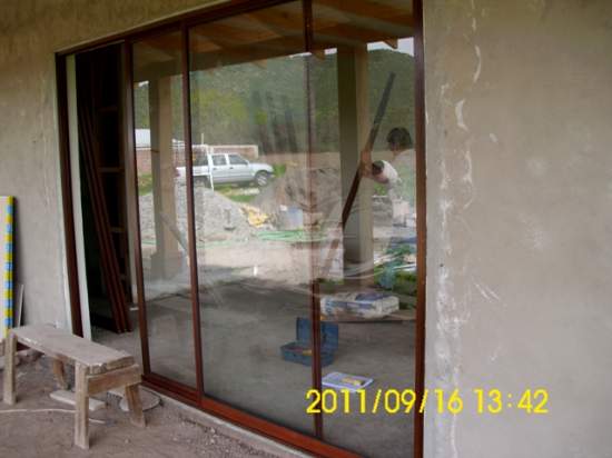 Ventanas de madera y aluminio natural